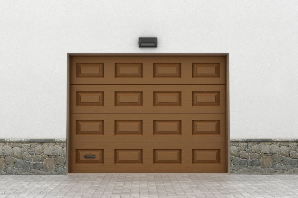 A wooden garage door in need of garage door services 